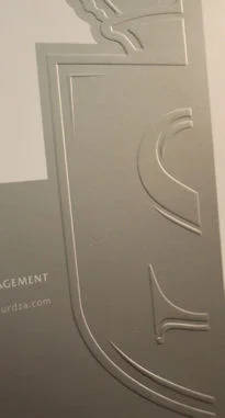 Embossed crest