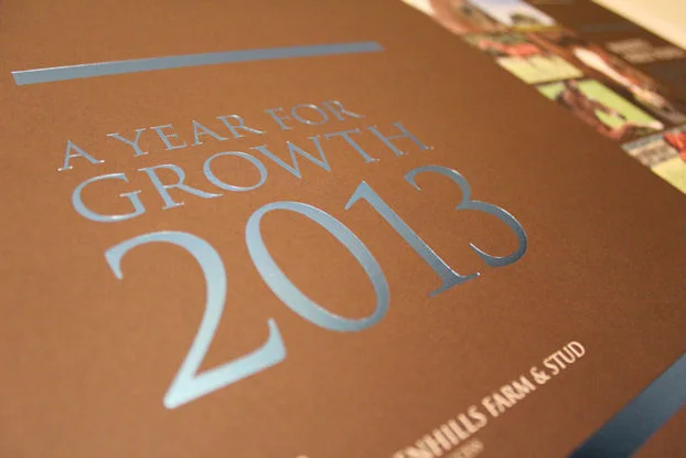 Silver foil on brown board